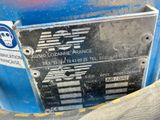 a close up of a sign on the side of a blue machine