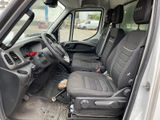 the interior of a van with the front seats up and the passenger seat down