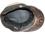 a brown hat with a black brimle on it