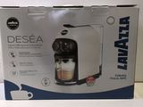 the box of the coffee maker is open and ready to be used