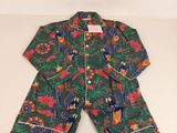 a green and red pajamasuitt with a floral pattern on it