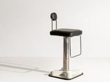a black stool with a black seat on a white surface