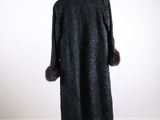 a black coat with a fur collar on a mannequin mannequin mannequin mannequin mannequin mannequin mannequin manne