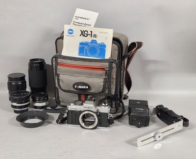 a camera and some other items on the table