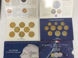 a lot of coins and a book on a table