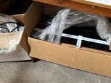 a box that has some items in it on the floor
