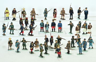 a lot of figurines that are on a white surface