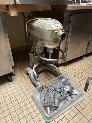 an image of a kitchen with a mixer on the floor