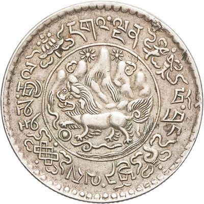a close up of a silver coin with a bird on it