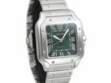 an image of a silver wrist watch with a green dial