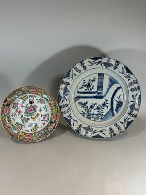 two plates and a bowl are sitting on a table
