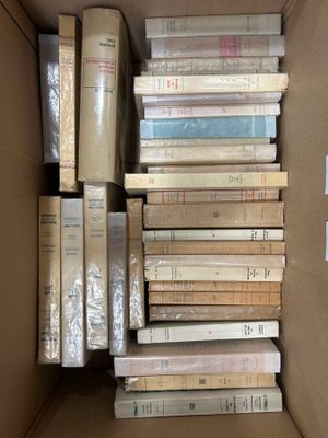 a box full of books sitting on top of each other