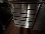 a large oven sitting inside of a kitchen next to a counter