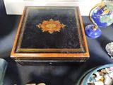 a black table with a wooden box on top of it