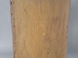 an image of a piece of wood on a black stand