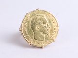an image of a gold coin ring with a man ' s face on it
