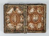 a wooden box with a decorative design on the inside