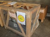 a wooden box with a sign on it sitting in a warehouse