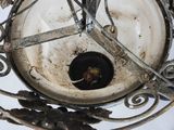 a white plate with a black bowl inside of it
