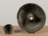 two vases that are sitting on a table