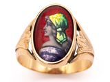 an image of a gold ring with a picture of a woman in a turban on it