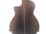 the back of an acoustic guitar with a wooden body and strings