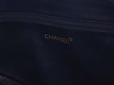 chanel, a black leather shoulder bag with gold hardware