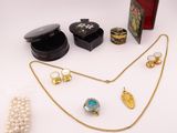 a lot of jewelry sitting on a white surface