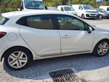 a white car parked in a parking lot next to other cars