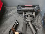 an image of a vacuum cleaner and other items on a table