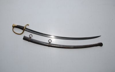 a pair of swords with a gold handle on a white surface