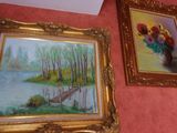 two paintings hanging on the wall next to each other