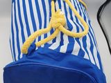 a blue and white bag with a yellow rope on it