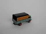 a toy truck that is sitting on a white surface