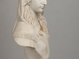 marble bust of a woman with a veil on her head