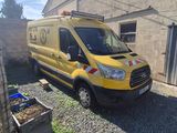 a yellow van that is parked in front of a building