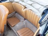 a tan leather seat in the back of a car