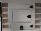 a black and white picture of a white box with black handles