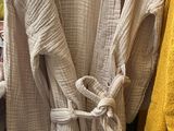 a lot of clothes on a rack in a store