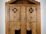 an old wooden cabinet with two doors and a door on one side