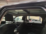 a black car with black leather seats in a car showroom