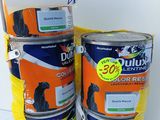 several cans of paint are stacked on top of each other