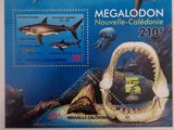 a close up of a stamp with a shark and other animals on it