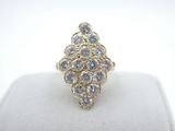a close up of a diamond ring on a ring stand