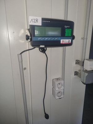 an image of a digital device mounted on a door