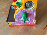 a toy train that is sitting on a wooden table