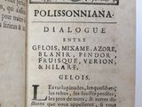 an old book that is open on a table
