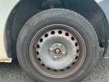a white car that has a flat tire on it