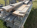 several pieces of wood are stacked on top of each other in the grass