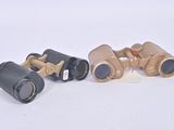 three different types of binoculars sitting on top of a white surface